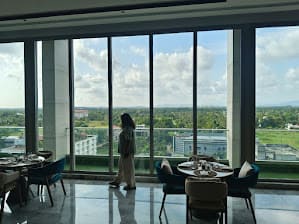 Smiling Rehna with warm, familial ambiance