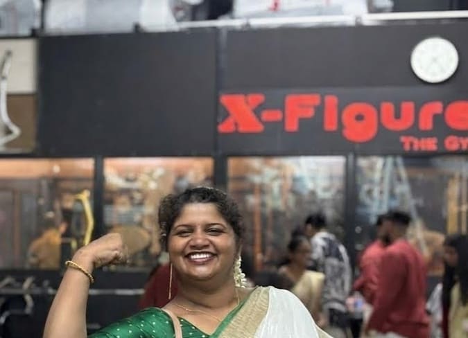 Rehna at the gym focused on strength and wellness